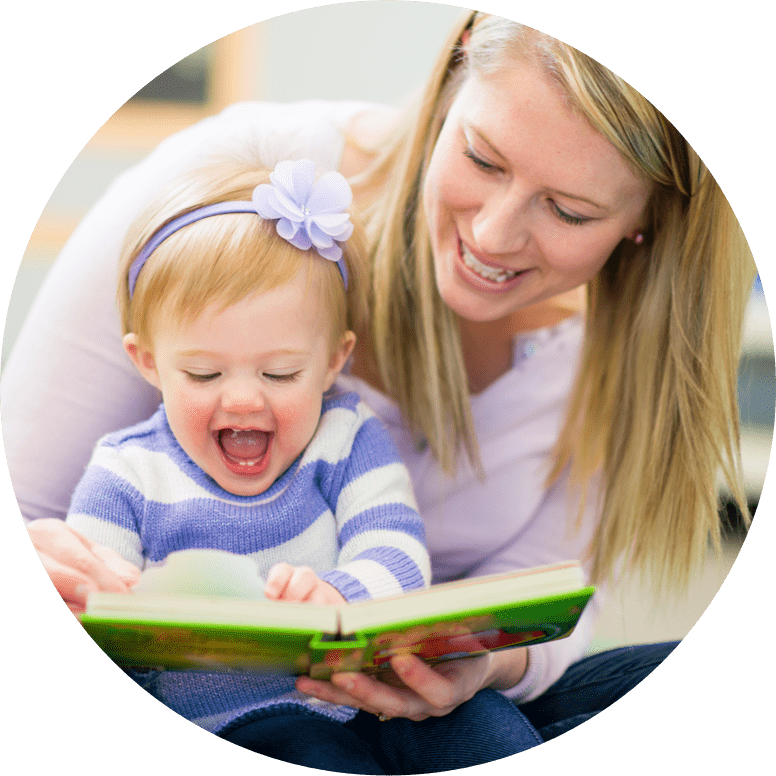 woman reading a book for a child