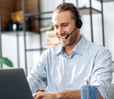 male receptionist with headset taking calls