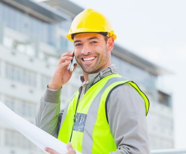 Construction tradesman talking over phone